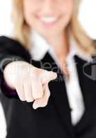 Close-up of a  young businesswoman showing with a finger at the
