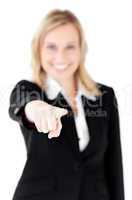 Bright young businesswoman showing with a finger at the camera
