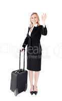 Delighted young businesswoman waving at the camera