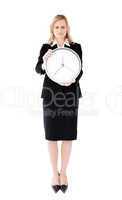 Frustrated businesswoman holding a clock against white backgroun