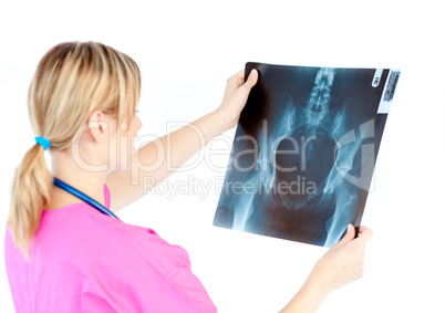 Caucasian female surgeon looking at a x-ray