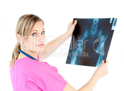 Serious young surgeon holding a x-ray