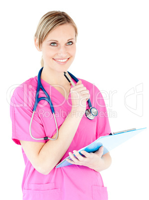 Thoughtful female surgeon holding a clipboard