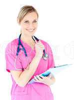 Thoughtful female surgeon holding a clipboard