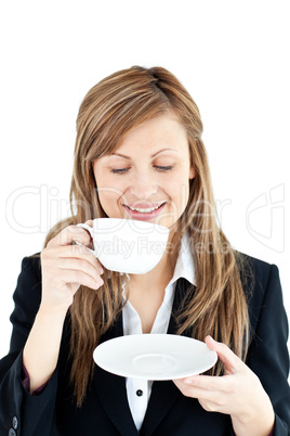 Merry businesswoman drinking a coffee