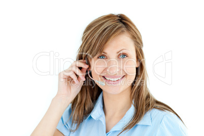 Delighted businesswoman talking on headphones
