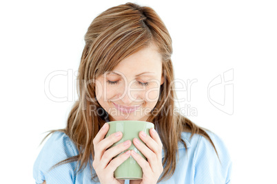 Cute woman enjoying her coffee standing