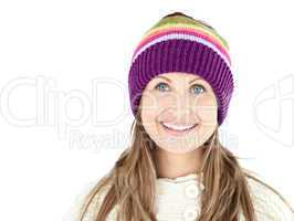 Smiling woman wearing a cap and pullover
