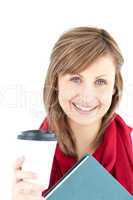 Cheerful caucasian woman holding a book and coffee