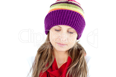 Depressed young woman wearing a cap and scarf