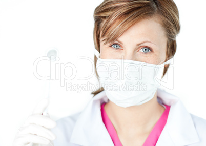 Female dental surgeon wearing a mask