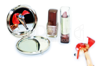 Glass dachshund looking in the make-up mirror