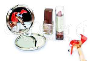 Glass dachshund looking in the make-up mirror