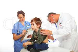 Doctor and Nurse examining a boy