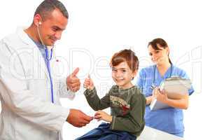 Male Doctor and nurse examining a boy