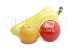 Paprica, red and yellow cocktail tomatoes isolated on white
