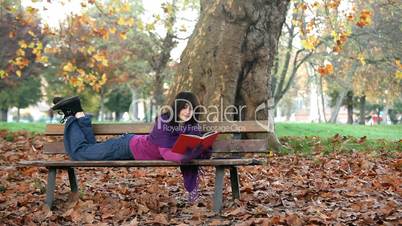 student reading on bench