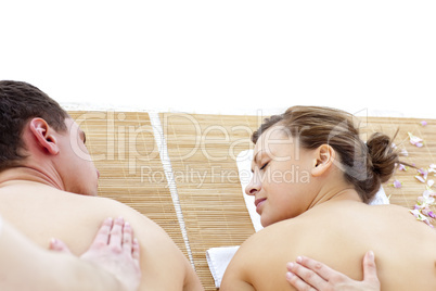 Relaxed couple receiving a back massage
