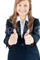 Close-up of an enthusiastic businesswoman with thumbs up