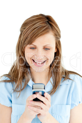 Enthusiastic businesswoman writing a message on her cellphone