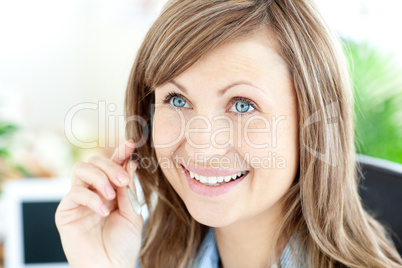 Portrait of a charming businesswoman wearing headphones