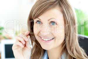 Portrait of a charming businesswoman wearing headphones