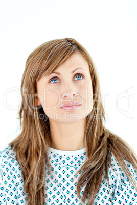 Morbid female patient looking upwards wearing patient gown