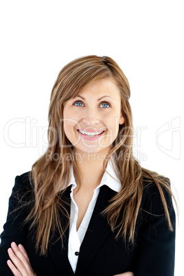 Cheerful businesswoman with folded arms looking upwards