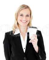 Joyful businesswoman holding a coffee smiling at the camera