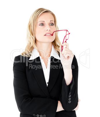 Thoughtful young businesswoman  holding glasses