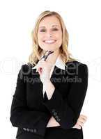 Confident businesswoman holding  glasses smiling at the camera