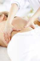 Close-up of a caucasian woman receiving a back massage