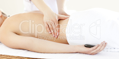 Resting young woman having a back massage