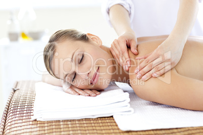 Caucasian young woman enjoying a back massage