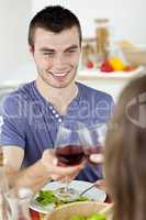 Handsome young man having dinenr with his girlfriend