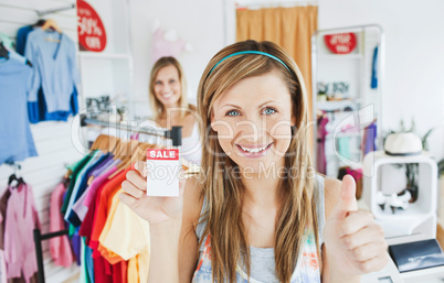 Animated young woman holding a sales paper into the camera with