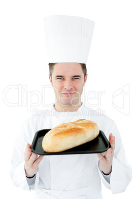 Self-assured chef holding a fresh bread