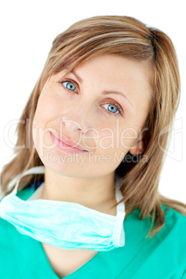 Sophisticated young female surgeon smiling at the camera