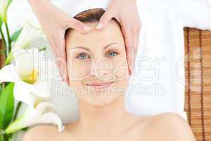 Glowing woman having a head massage