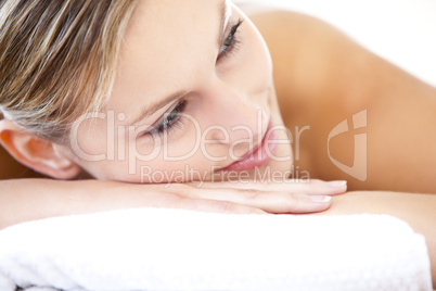 Close-up of a beautiful woman lying on a massage table