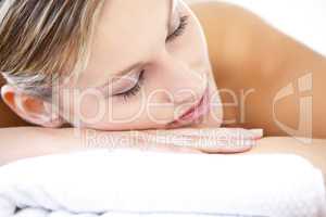 Close-up of a relaxed woman lying on a massage table