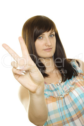 Smiling girl making victory gesture