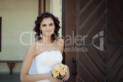 Young woman posing in white dress