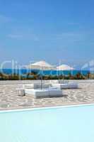 Sunbeds at swimming pool of luxury hotel, Antalya, Turkey