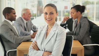 Young Businesswoman Smiling at a Board Room Meeting