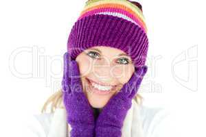 Radiant young woman with cap and gloves in the winter
