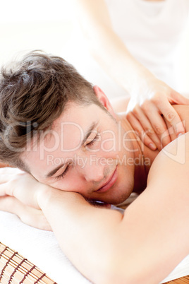 Attractive young man enjoying a back massage