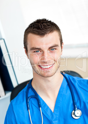 Smiling surgeon looking at the camera wearing scrubs