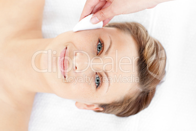 Attractive young woman receiving a beauty treatment