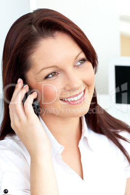 Bright caucasian businesswoman talking on phone with her cellpho